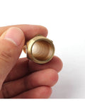 Rock Solid Heavy Duty Brass Sprinkler Nozzle With One Half Inch Male Thread showing interior view of copper fitting.