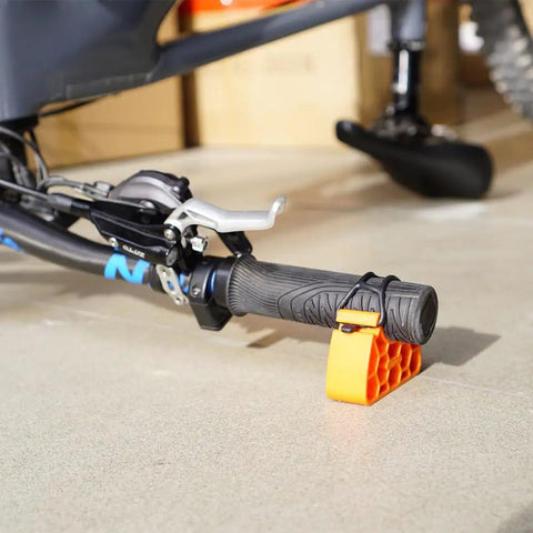 Clip On Bike Handlebar Stand Set For Inverted Parking And Bike Maintenance, orange stand elevates MTB bars, protects levers.