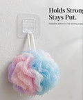 Sick Wall Mount Hooks, Totally Rust Proof Storage Rack For Coats, Bags, And Picture Hanging displaying a bath loofah on a clear adhesive hook.
