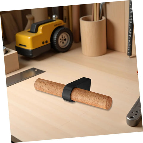 Solid Wood Cabinet Handle Black Drawer Pulls With Single Hole on a wooden surface next to a ruler and tools