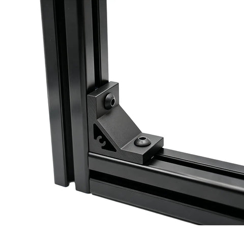 Eight Piece Set Of Tough As Nails Black Corner Brackets Built For 4040 And 4080 Aluminum Extrusion Profiles Featuring Slick Anodized Finish And Complete M8 Hardware Bundle, close-up view of black bracket on aluminum frame.