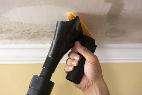 Popcorn Ceiling Scraper Vacuum Attachment for Shop Vacuums being used on unpainted ceiling for mess-free texture removal