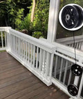 Rock Solid Reinforced 6X2 Inch V Groove Wheel Cast Iron Roller With Pre Installed Bearing Set Of 2 For Slide Gates Rollup Door Seven Eighth Inch Groove V Track 2000 Lb Capacity Black Pack installed on a wooden deck railing.