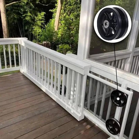 Rock Solid Reinforced 6X2 Inch V Groove Wheel Cast Iron Roller With Pre Installed Bearing Set Of 2 For Slide Gates Rollup Door Seven Eighth Inch Groove V Track 2000 Lb Capacity Black Pack installed on a wooden deck railing.