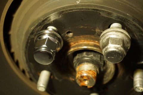 Close-up of M12x1.5 Wheel Lug Nut Stud Set 37mm 4 Pieces Compatible With Toyota, showing mounted lug nut on wheel hub.