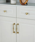 Premium Solid Brass Cabinet Pulls 5 Pack With 5 Inch Center Hole Gold Drawer Handles For Kitchen Cupboard Furniture And Bathroom Fixtures Bringing Sweet Kitchen Vibes And A Fly Classic Look on a white cabinet.