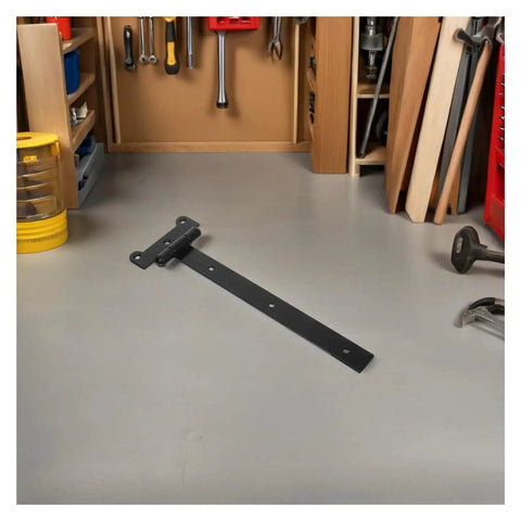 Heavy Duty Self Closing Reversible T Shaped Door Hinge In Black Finish on workshop table with tools, smooth durable design.