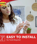 Person holding a Medium Utility Hooks Kit With Nine Wall Hooks And Twelve Adhesive Strips For Damage Free Hanging Up To Three Pounds