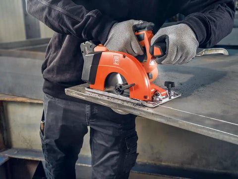 Built Tough Cordless Circular Saw For Spark Free Cold Cuts On Sheet Metal And Steel Pipe Works Like A Charm With Standard 18V Packs Comes Loaded With Two Heavy Duty Batteries And Quick Charger in use on metal sheet.