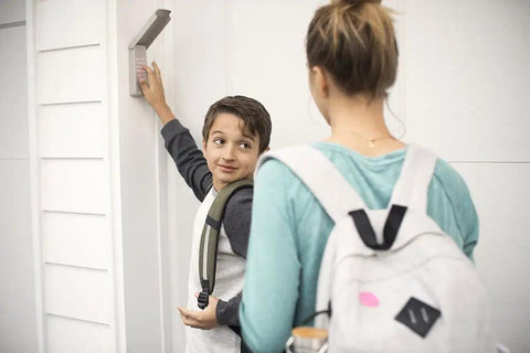 Child using Keyless Garage Door Access System With One Button Entry For Most Openers That Works With Major Brands Like LiftMaster And Craftsman