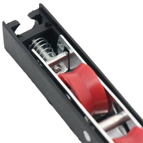 Close-up of Heavy Duty Sliding Door Rollers 4 Pack Dual Wheel Pulley Kit showing red wheels and metal spring mechanism.