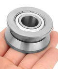 Heavy Duty V Groove Roller Guide Sealed Ball Bearing Built Like a Tank for Textile Machinery and Machine Tools Featuring Heat Treated Steel held in hand