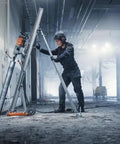 Worker using Straight Up Kickass Core Drill And Stand With 4.29 Hp Motor Three Speed Gears in a concrete environment.