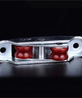 Smooth As Butter Heavy Duty Sliding Door Rollers And Pulley System With 12 Double Wheel Track Carts, red wheel rollers in steel housing.