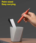 Slick 24-In-1 Mini Screwdriver Set with Eyeglass Repair Kit and Precision Bits for Tiny Screws Perfect Pocket Sidekick for Daily Chores and Road Trips in Sleek Cinnabar Red Finish held over a gray pot.