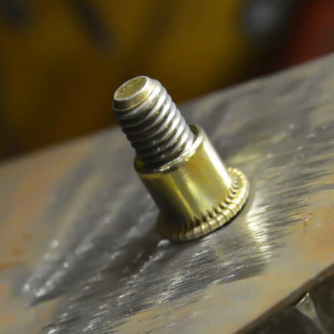Close-up of a galvanized carbon steel rivet nut inserted into metal, part of Rivet Nut Assortment Kit 500 Pcs Galvanized Carbon Steel M3 M4 M5 M6 M8 M10 Ideal for Industrial and Furniture Assembly Bulk Pack With Multiple Specifications to Fit Every Project and Keep Your Fastener Game Strong.
