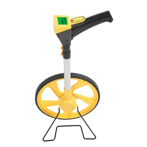 Digital Measuring Wheel With Bright Display Flips Effortlessly Between Feet And Meters For Heavy Duty Landscaping Surveying And DIY Projects That Demand Dead Nuts Precision Without Any Hassle showing yellow wheel and digital display from above.