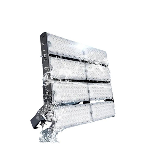 Built Tough Outdoor Flood Light With IP65 Rain Shield Housing And Rich 3000K Warm White Tone Perfect For Garage Security Sports Complex Stadium Lighting Gear with water splash effect.