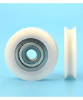 10 Pack U Groove Nylon Pulley Wheels Featuring Plastic Coated Bearings With A 12mm Bore And 60mm Diameter viewed from front and side