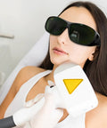 Top Shelf Laser Safety Glasses With Od Four Plus Filtering And Smooth Vision For Lab Crews Looking For Heavy Duty Eye Shield Gear With No Sweat Protection Today, worn by a woman during a treatment.