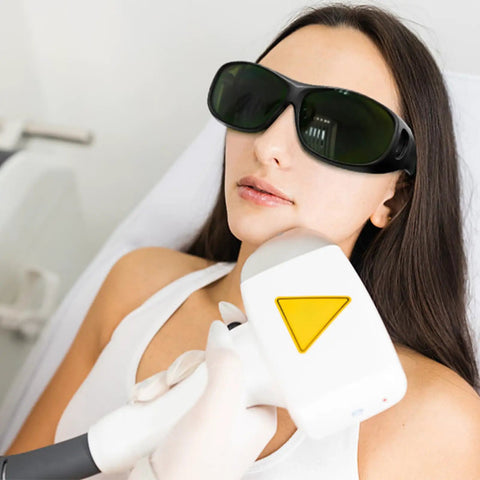 Top Shelf Laser Safety Glasses With Od Four Plus Filtering And Smooth Vision For Lab Crews Looking For Heavy Duty Eye Shield Gear With No Sweat Protection Today, worn by a woman during a treatment.
