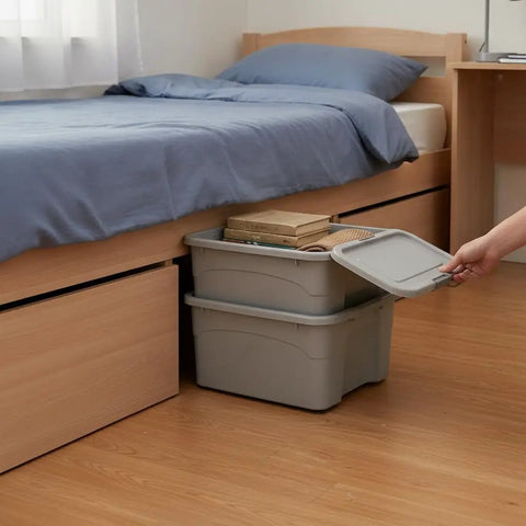 Heavy Duty Stackable Storage Totes With Secure Hinged Lids And Smooth Rolling Casters Plus Reinforced Side Handles For Clutter Free Closet Organization And Dorm Spaces under bed storage with books on top.