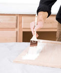 Applying Cabinet Coat Urethane Acrylic Satin Enamel Paint For Cabinets White 1 Gallon on wood with brush.