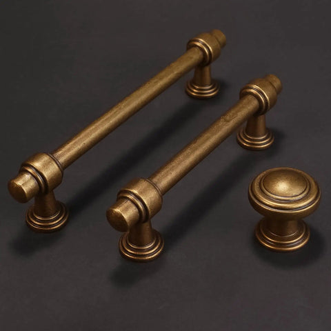 10 Pack Antique Brass Cabinet Pulls With 5 Inch Spacing Hella Tough Zinc Alloy Vintage Drawer Handles For Kitchen Cabinets And Bathroom Vanities Offering Top Shelf Aged Gold Finish on dark background.