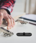 Concealed Door Hinges Set Hidden Pivot Black Stainless Steel 4 Pack shown with installation on indoor door.