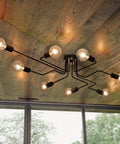 Eight Light Sputnik Ceiling Fixture in Matte Black Cool Industrial Chandelier Semi Flush Mount Installed in Living Room