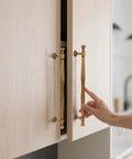 Antique Brass Cabinet Pulls 5 Inch Center To Center Zinc Alloy Solid Drawer Handles for Bedroom and Kitchen installed on light wood cabinet