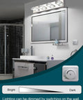 Five Light LED Vanity Light Bar For Bathrooms 31.5 Inch Modern Over Mirror Mount Glass And Stainless Steel Long Light Easy 15 Minute Install 32 Watt LED High Brightness Fixture, shown in a bathroom setting above a mirror.