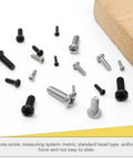 Various black and silver screws from the Top Shelf Assorted Metric Micro Screw Kit Packing 1200 Phillips Pan Head Fasteners.