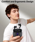 True Wireless Bluetooth Earbuds With 60 Hours Of All Day Juice And Dual Led Power Display Featuring IPX5 Waterproof Rating Portable Wireless Charging Case Built In Microphone For Phone Laptop And Gym Workouts Total Game Changer in a man's hand showing ergonomic design.