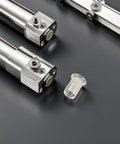 Stainless Steel Pro Grade Rivet Nut Kit 70 Pack Flat Head Threaded Inserts next to precision instruments on gray surface