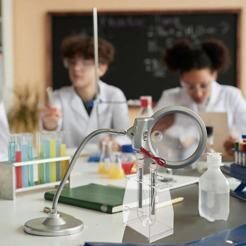Hands-On Water Electrolysis Demonstration Kit For Science Class on desk with students in background, showing setup and use