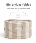 Slick Striped Woven Storage Basket With Beige And White Accents, 11x11 inches, showing folded state before regaining shape.