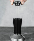 Pro Grade 58 Millimeter Espresso Tamper Plus Five Pin Coffee Distributor Needle Tool Two In One Ground Press Barista Kit in use.