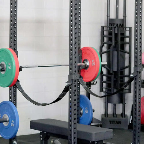 Hardcore Power Rack Safety Straps Rated Five Thousand Pound With Bounce Free Catch Tech Built From Beefy Nylon Webbing For Dead Silent Drops And Knurl Guard Coverage Home Gym Flex Essential Set Of Two mounted on a power rack.