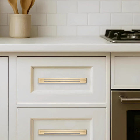 5 Pack 5 Inch Center To Center Champagne Bronze Cabinet Pulls With Matching Backplates installed on white kitchen drawers