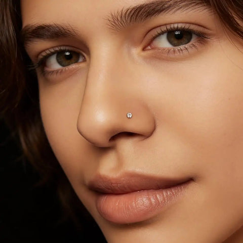 Close-up of Implant Grade Titanium Nose Stud 20G with Dope Cubic Zirconia Sparkle on model's nostril, perfect for sensitive skin.