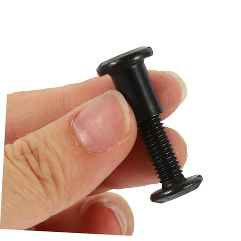 Top Shelf Five Piece Pack Of Black Stainless Steel Binding Screws And Nuts For Scrapbooks Photo Albums And Bookbinding With Countersunk Flat Head For No Sweat Setup in hand, showcasing a black binding screw.