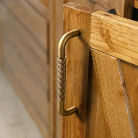 Six Pack 5 Inch Champagne Bronze Knurled Cabinet Pulls With Crosshatch Knurling on wooden cabinet door