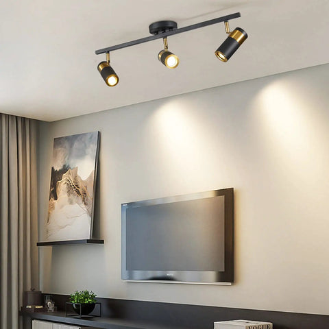 Three Light Black Track Lighting With Rotatable Heads GU10 Ceiling Spotlights For Living Room Hallway Studio Adjustable Indoor LED Spotlight Fixtures Now installed in a modern living room.