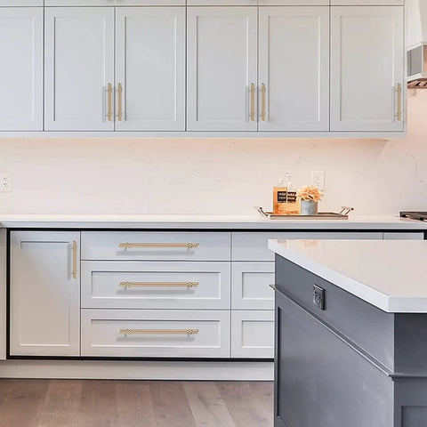Sleek Knurled Gold Cabinet Pulls For Kitchen Drawers Top Shelf Hardware on white and gray kitchen cabinetry.