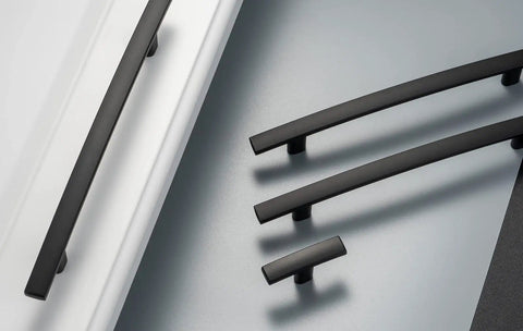 Top Tier Matte Black Cabinet Pulls And Drawer Handles 10 Pack Solid Metal Kitchen Hardware on light surface, showing curved design.