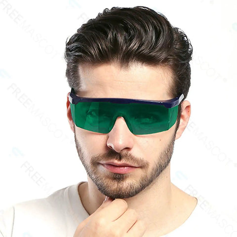 Close-up of a man wearing Top Shelf Laser Safety Glasses Hella Secure Against Uv Blue Red And Infrared Beams Od4 Plus Lens.