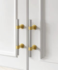 Solid Cabinet Pulls And Drawer Handles 10 Pack Featuring Smooth Brushed Nickel Finish With Straight Up Gold Accents on white cabinet doors.
