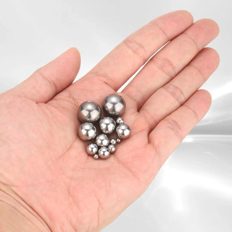 Hand holding 3MM stainless steel bearing balls from a 1000 Pack, showcasing durability for paint mixing and repairs.