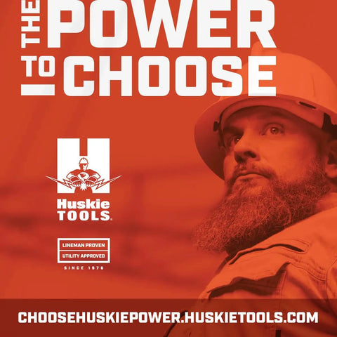 Worker in hard hat with 'The Power to Choose' Husky Tools advertisement backdrop.
